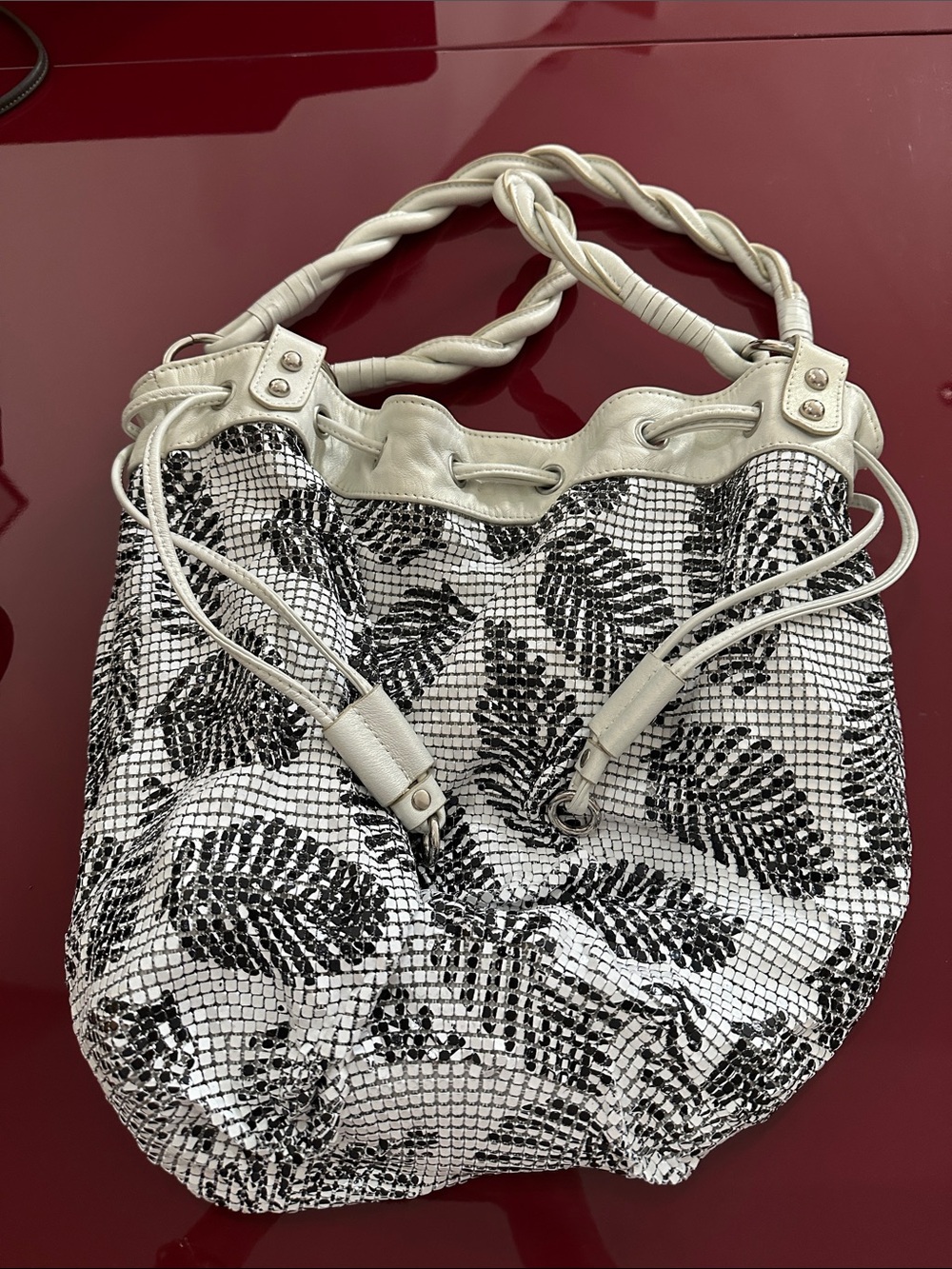 Adrienne Vittadini White and Black Leaf-Print Drawstring Shoulder Bag